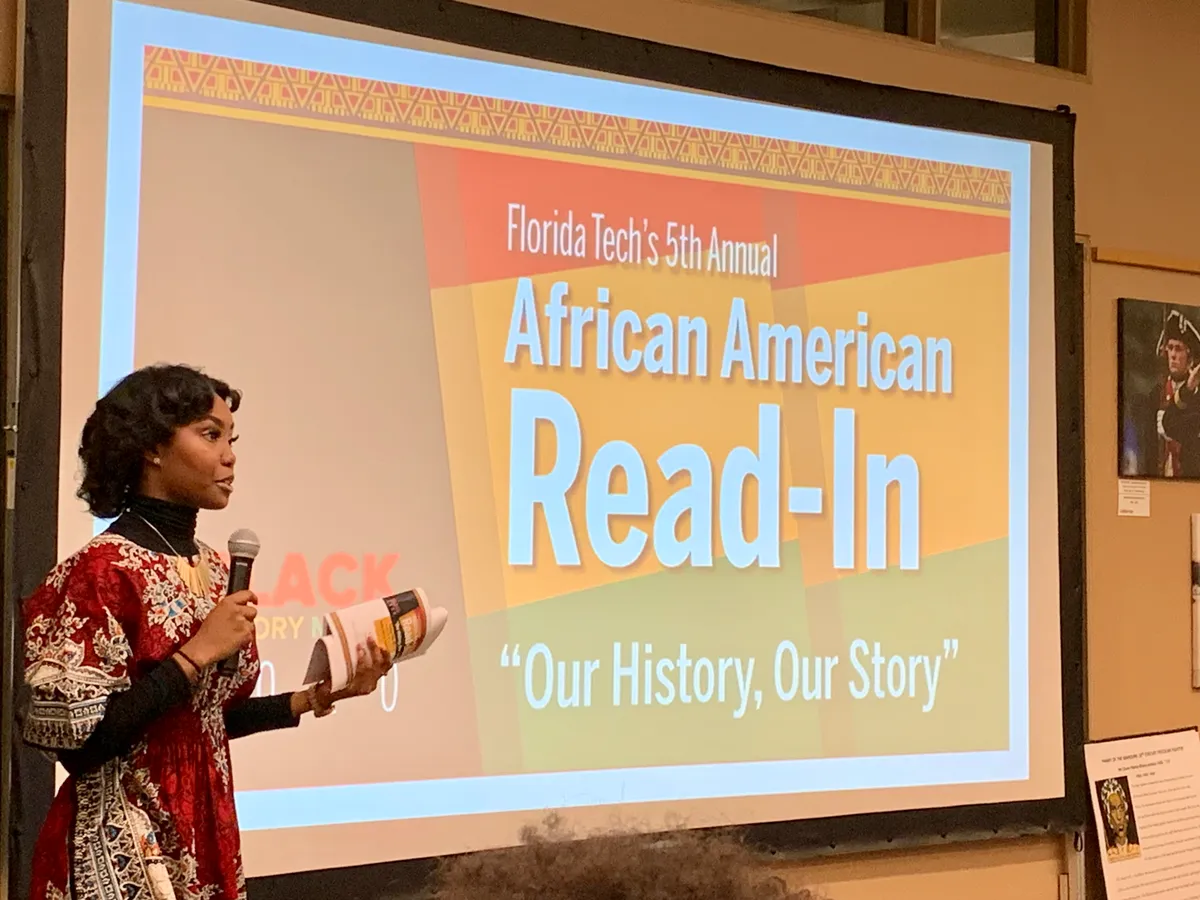 Jessica Applewhite speaking at the 5th Annual African American Read-In.