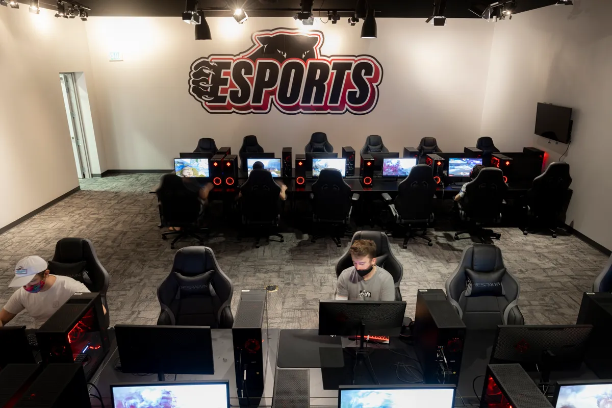 Room filled with 24 gaming stations for students to use.