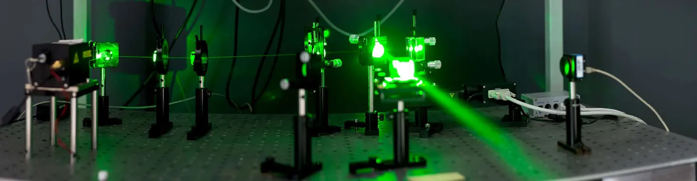 Green laser through glass experiment.