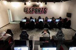 Room filled with 24 gaming stations for students to use.